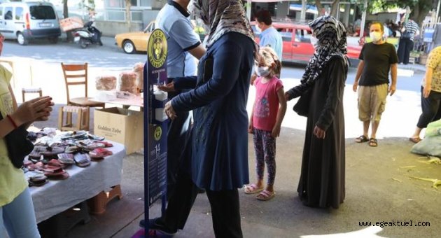 Buca pazarlarında dezenfektanlı önlem